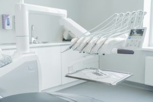 A hospital room with a bed and a mirror