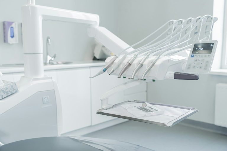 A hospital room with a bed and a mirror